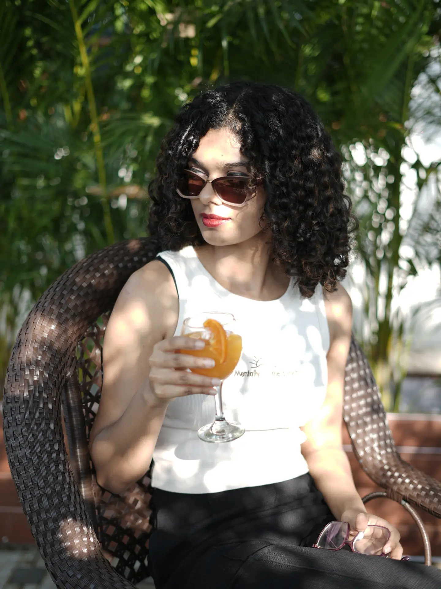 Guest enjoying a drink in the garden light